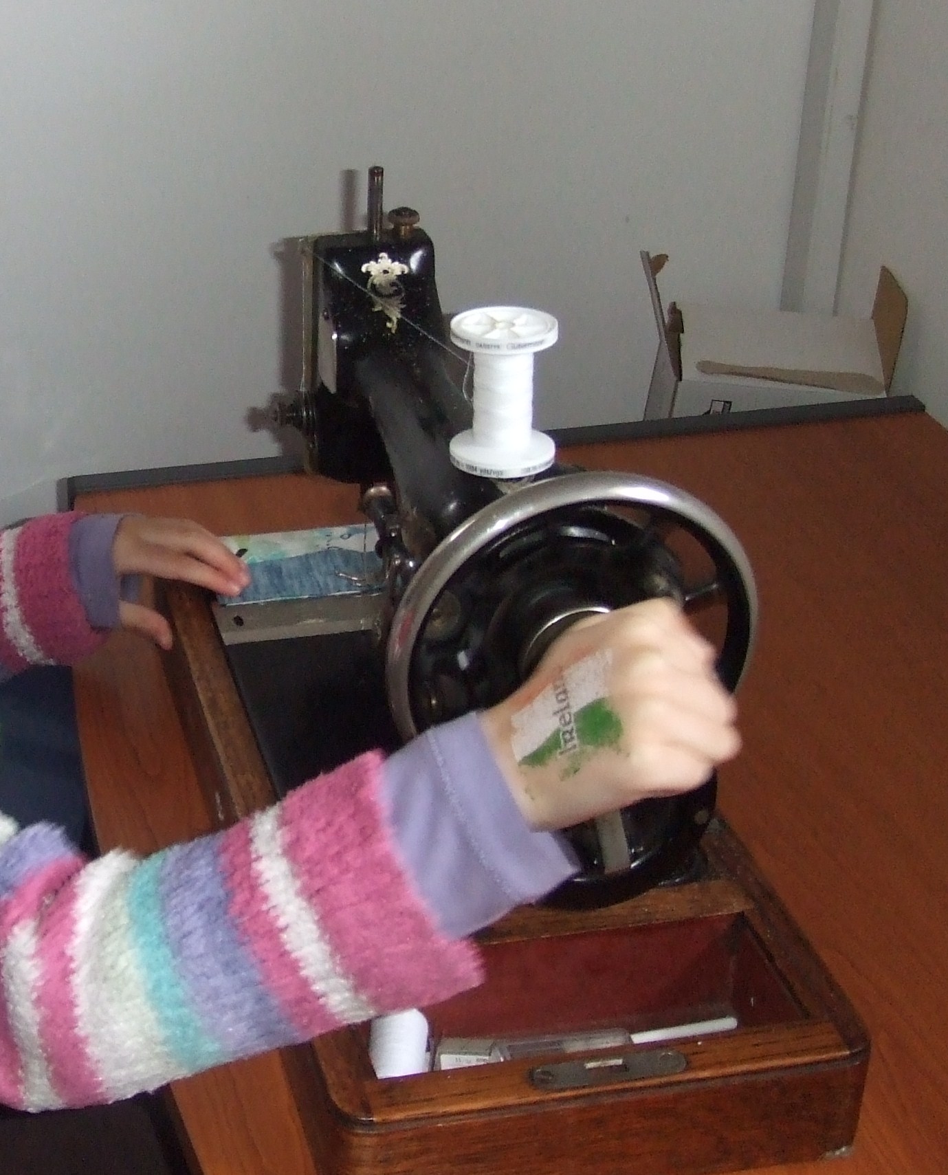 Sewing a frame to the painted fabric squares